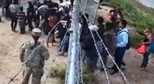 Shocking Footage Shows US Soldier Opening Gate to Let Migrants onto Private Property in Texas