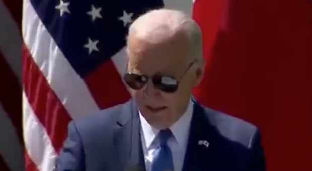 Reflection in Biden’s Sunglasses Shows Him Reading Instructions from His Handlers